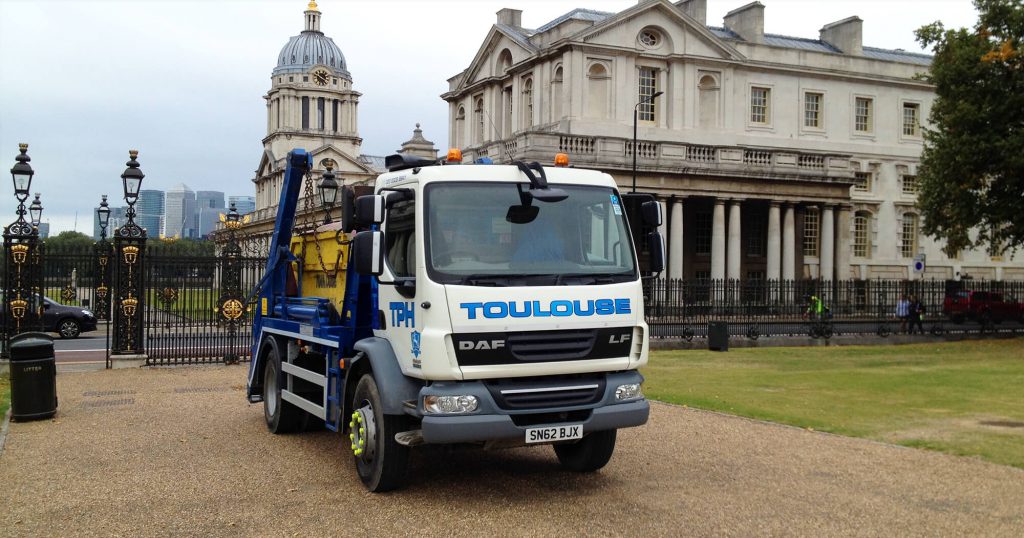 plant hire truck in front of London building